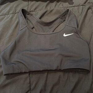 This is a used small kids Nike bra. It has been washed.